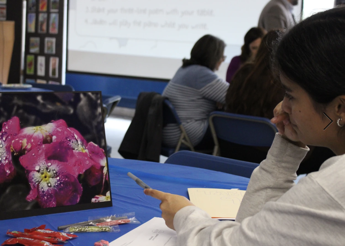 Students participate in a variety of Poetry Night activities, including a poetry inspiration exercise, a poetry guessing game and coloring, among many others.